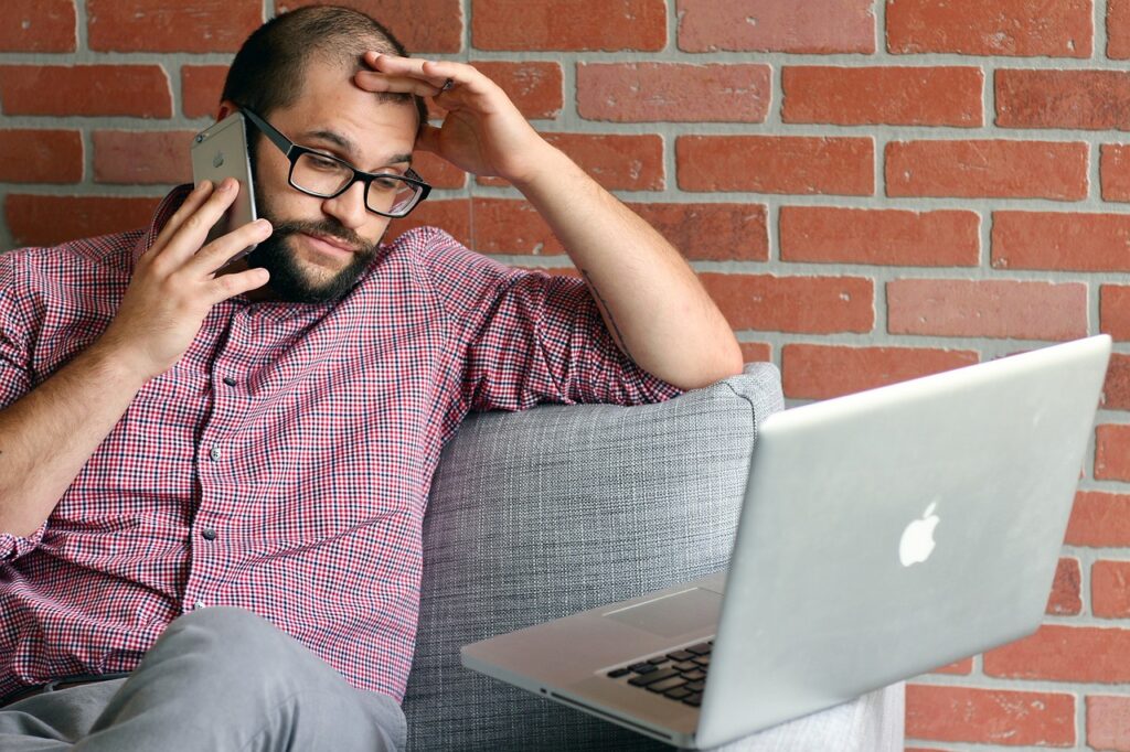 man stressed doing taxes